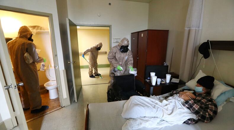 Georgia National Guardsmen disinfect a resident's room at a nursing home in Atlanta amid the coronavirus pandemic in April 2020.