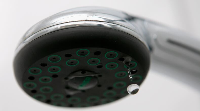SCHWELM, GERMANY - JANUARY 10: Water drips from a shower head on January 10, 2007 in Schwelm, Germany. (Photo Illustration by Christof Koepsel/Getty Images)