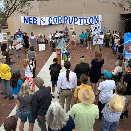 Protesters gather outside the New Mexico Environment Department to voice opposition to the Project Jupiter data center during a demonstration in Santa Fe, N.M., Friday, Aug. 21, 2026. (AP Photo/Susan Montoya Bryan)