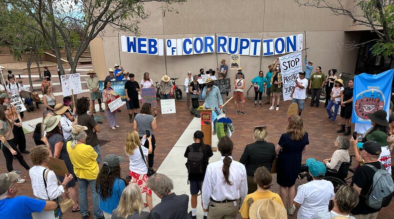 Protesters gather outside the New Mexico Environment Department to voice opposition to the Project Jupiter data center during a demonstration in Santa Fe, N.M., Friday, Aug. 21, 2026. (AP Photo/Susan Montoya Bryan)