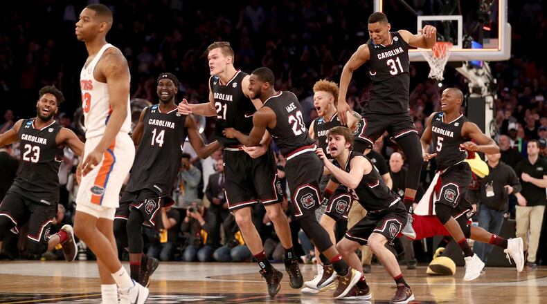 South Carolina Gamecocks celebrate defeating the Florida Gators to win the 2017 NCAA Men's Basketball Tournament East Regional at Madison Square Garden March 26, 2017, in New York City.