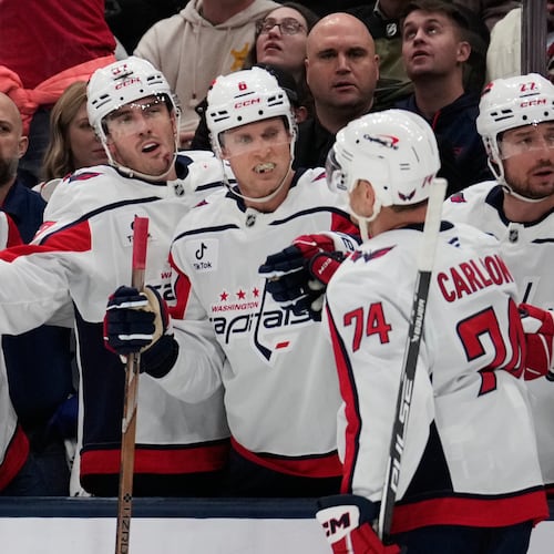 Washington Capitals defenseman John Carlson (74) is congratulated by teammates after scoring in the second period of an NHL hockey game against the Columbus Blue Jackets Friday, Oct. 24, 2025, in Columbus, Ohio. (AP Photo/Sue Ogrocki)