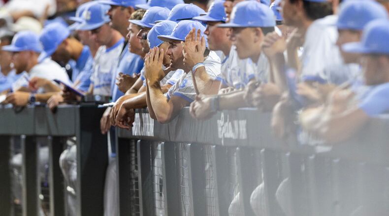 North Carolina players watch from the dugout as Oklahoma goes to bat in the ninth inning of Game 3 of the NCAA College World Series baseball finals in Omaha, Neb., Monday, June 22, 2026. (AP Photo/Rebecca S. Gratz)
