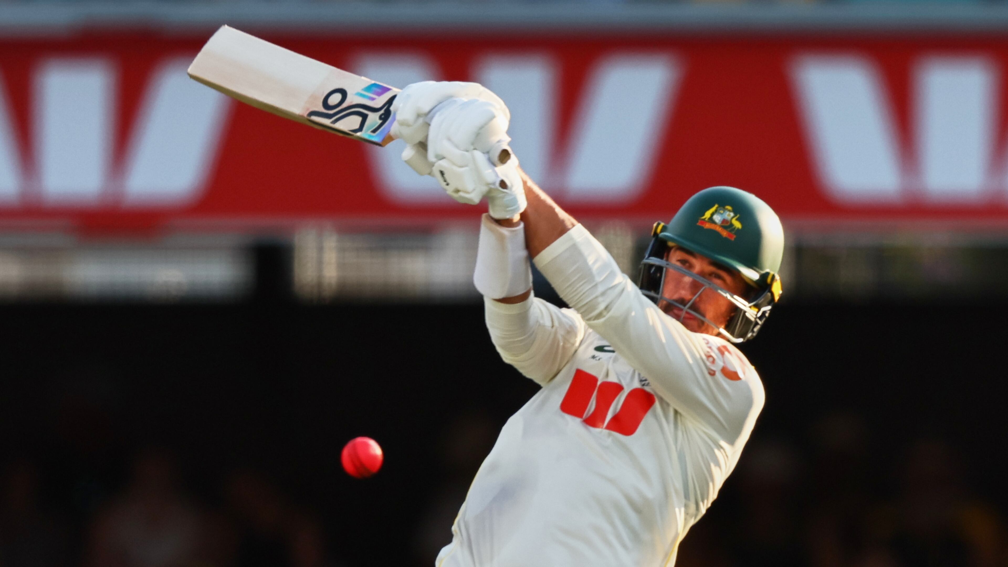 Australia's Mitchell Starc plays a shot during the second Ashes cricket test match between Australia and England in Brisbane, Saturday, Dec. 6, 2025.. (AP Photo/Tertius Pickard)