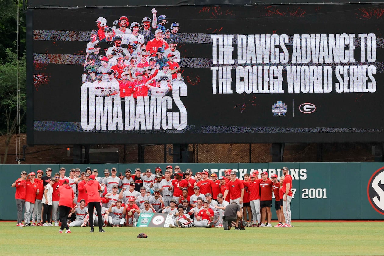 The Georgia Bulldogs pose for their team photo after winning the NCAA Super Regional series by defeating the Mississippi State Bulldogs 11-9 in extra innings at Foley Field on Sunday, June 7, 2026, in Athens. Miguel Martinez/AJC)