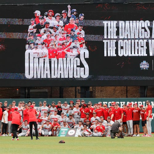 The Georgia Bulldogs pose for their team photo after winning the NCAA Super Regional series by defeating the Mississippi State Bulldogs 11-9 in extra innings at Foley Field on Sunday, June 7, 2026, in Athens. Miguel Martinez/AJC)