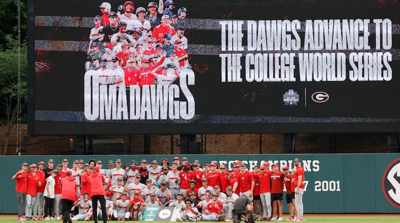 The Georgia Bulldogs pose for their team photo after winning the NCAA Super Regional series by defeating the Mississippi State Bulldogs 11-9 in extra innings at Foley Field on Sunday, June 7, 2026, in Athens. Miguel Martinez/AJC)