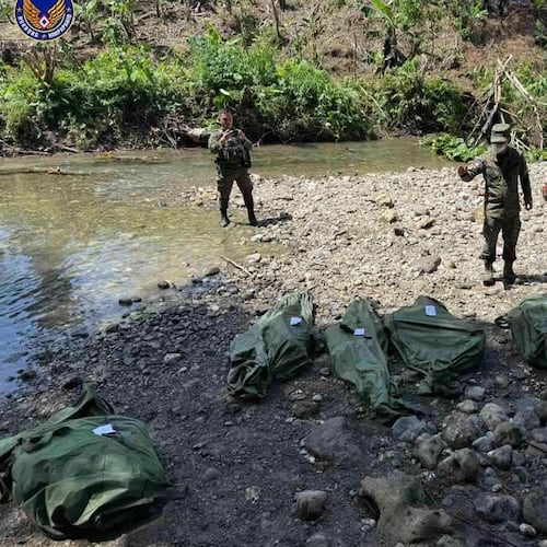 In this photo provided by the Philippine Air Force, Philippine Air Force personnel retrieve the remains of the pilots and crew of the Super Huey helicopter on Wednesday, Nov. 5, 2025, a day after it crashed in Agusan del Sur province, southern Philippines while on a humanitarian and disaster response mission due to Typhoon Kalmaegi. (Philippine Air Force via AP)