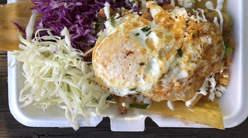 This tamale bowl, with a green pork tamale and all the fixings, is from La Mixteca Tamale House in Gwinnett County. CONTRIBUTED BY WENDELL BROCK