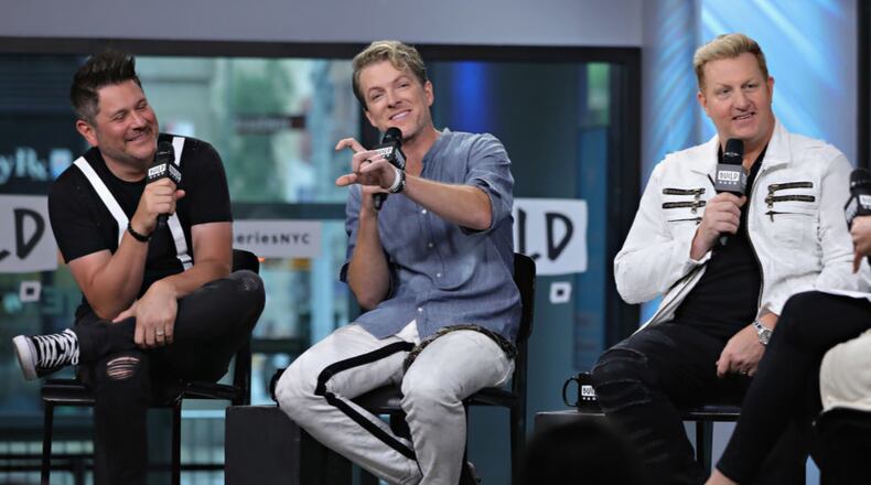 Jay DeMarcus, Joe Don Rooney and Gary LeVox of Rascal Flatts surprised a Wisconsin bride and groom by performing at their wedding reception.