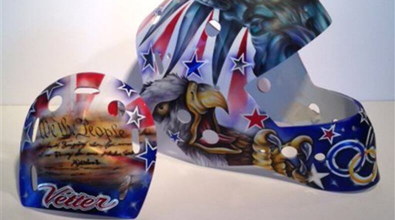 Jessie Vetter has had to change her helmet to remove a portion of the preamble to the US Constitution, with the words "We the People", the Olympic rings and her last name.