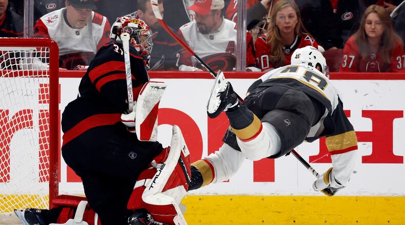 Vegas Golden Knights' Tomas Hertl (48) trips over Carolina Hurricanes goaltender Frederik Andersenn (31) during the second period in Game 1 of the NHL hockey Stanley Cup Final series in Raleigh, N.C., Tuesday, June 2, 2026. (AP Photo/Karl DeBlaker)