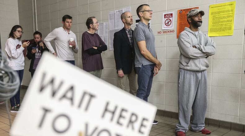 Voters lined up early at Henry W. Grady High School in Atlanta on Nov. 7 to cast their votes. Only about 20,000 of 250,000 registered voters cast early ballots in Atlanta’s mayoral election. JOHN SPINK/JSPINK@AJC.COM