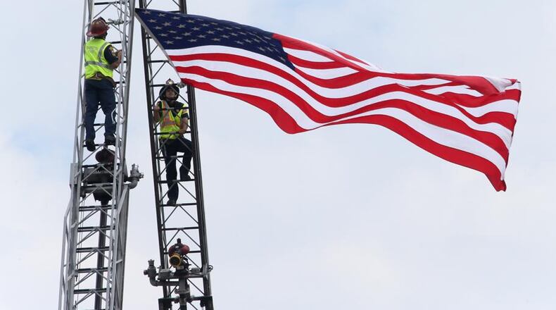 By summer next year, Cobb County should have a new ladder truck and three new firefighters to handle its operation. AJC file photo
