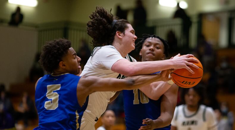 Grayson's Ian Schieffelin is swarmed by the McEachern defense. February 27, 2021, at Grayson High School in Loganville, Georgia. McEachern defeated Grayson 57-56 in overtime. CHRISTINA MATACOTTA FOR THE ATLANTA JOURNAL-CONSTITUTION