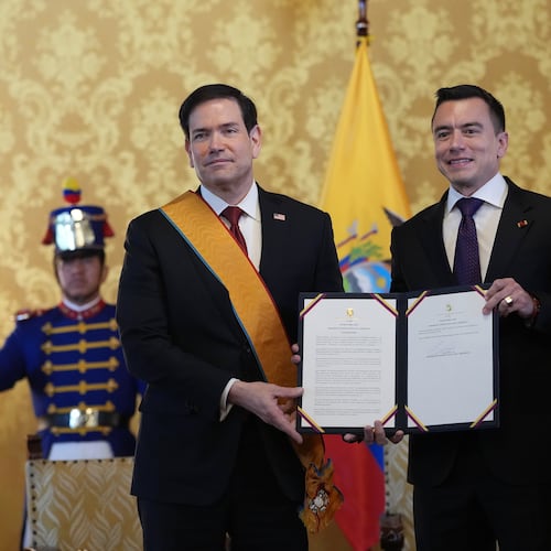 Ecuador's President Daniel Noboa, right, and U.S. Sec. of State Marco Rubio hold a document related to Ecuador's highest-ranking National Order of Merit, the Grand Cross, presented to Rubio, which he is wearing, at Carondelet palace in Quito, Ecuador, Wednesday, Sept. 9, 2026. (AP Photo/Dolores Ochoa, Pool)
