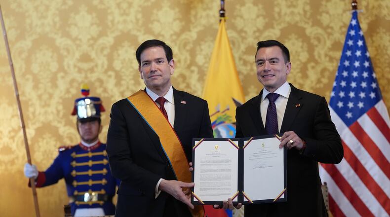 Ecuador's President Daniel Noboa, right, and U.S. Sec. of State Marco Rubio hold a document related to Ecuador's highest-ranking National Order of Merit, the Grand Cross, presented to Rubio, which he is wearing, at Carondelet palace in Quito, Ecuador, Wednesday, Sept. 9, 2026. (AP Photo/Dolores Ochoa, Pool)