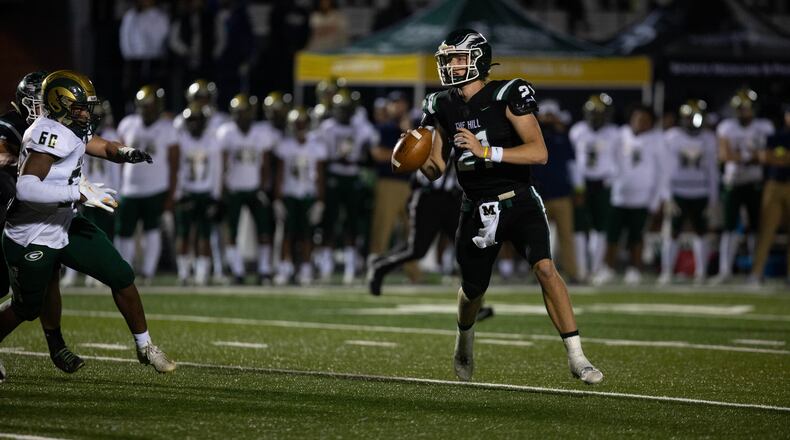 Collins Hill quarterback Sam Horn (21) carries the ball during a GHSA high school football game between the Collins Hill Eagles and the Grayson Rams at Collins Hill High in Suwanee, GA., on Friday, December 3, 2021. (Photo/ Jenn Finch)