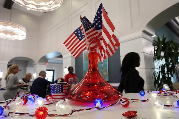 American flags and lights decorate a dining room as staff assist residents with an Independence Day buffet service, in the independent living facility at the Toby and Leon Cooperman Sinai Residences, July 4, 2025, in Boca Raton, Fla. (AP Photo/Rebecca Blackwell)