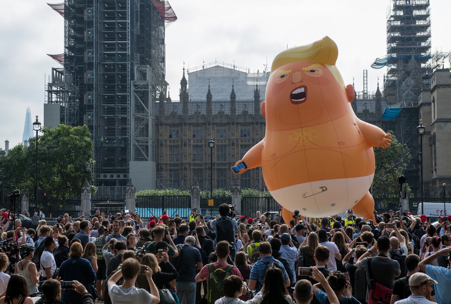 Photos: Baby Trump balloon flies over London protests