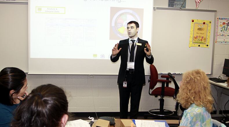 Gwinnett County Public Schools is giving a $700 bonus to teachers and other employees, such as counselors, paid on the same salary schedule. Here, science instructional coach Tyler Kinner leads a class for educators during the district’s Summer Teaching and Learning Conference. COURTESY OF GWINNETT COUNTY PUBLIC SCHOOLS