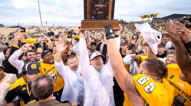 Kennesaw State coach Brian Bohannon and his Owls celebrate rout of Monmouth and the school's first conference championship. (Kyle Hess/Kennesaw State)