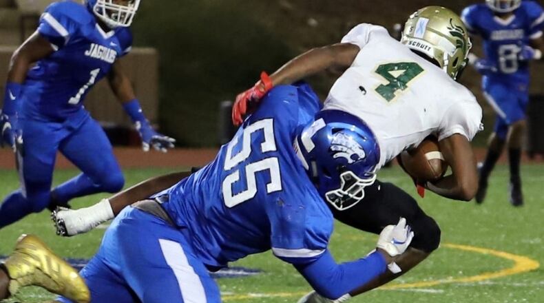 Stephenson defensive lineman Bailey Malachi (55) makes a tackle during the Jaguars 34-7 victory over Morrow on Sept. 20, 2019. (Photo by Arielle Hayes)