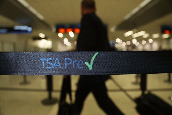 MIAMI, FL - JUNE 02: Travelers go through the TSA PreCheck security point at Miami International Airport on June 2, 2016 in Miami, Florida. As the busy summer travel season heats up the Transportation Security Administration is encouraging people to sign up for the TSA PreCheck program to save time going through the airports security lines. Those enrolled in the program can leave their shoes, light outerwear and belt on during the terminal screening process as well as keeping their laptop in the carry-on suitcase without having to remove them at the checkpoint. (Photo by Joe Raedle/Getty Images)