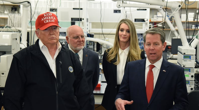 March 6, 2020 Atlanta - Gov. Brian Kemp speaks as President Donald Trump looks on at the headquarters of the Centers for Disease Control and Prevention in Atlanta on Friday, March 6, 2020. President Donald Trump visited the headquarters of the Centers for Disease Control and Prevention in Atlanta on Friday after all, after initially scrapping the trip over concerns that a staffer at the agency had contracted the coronavirus. (Hyosub Shin / Hyosub.Shin@ajc.com)