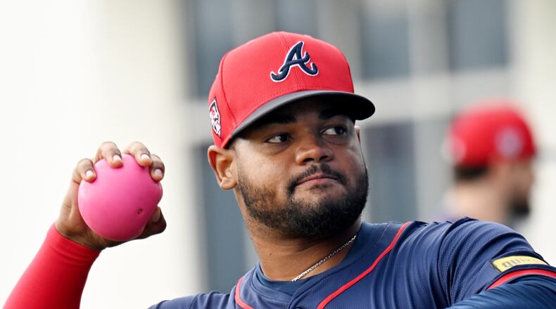 Atlanta Braves pitcher Reynaldo Lopez (40) warms up during spring training workouts at CoolToday Park, Saturday, February, 17, 2024, in North Port, Florida. (Hyosub Shin / Hyosub.Shin@ajc.com)