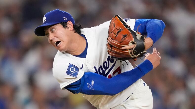 Los Angeles Dodgers starting pitcher Shohei Ohtani throws to the plate during the sixth inning of a baseball game against the San Diego Padres, Friday, July 3, 2026, in Los Angeles. (AP Photo/Mark J. Terrill)