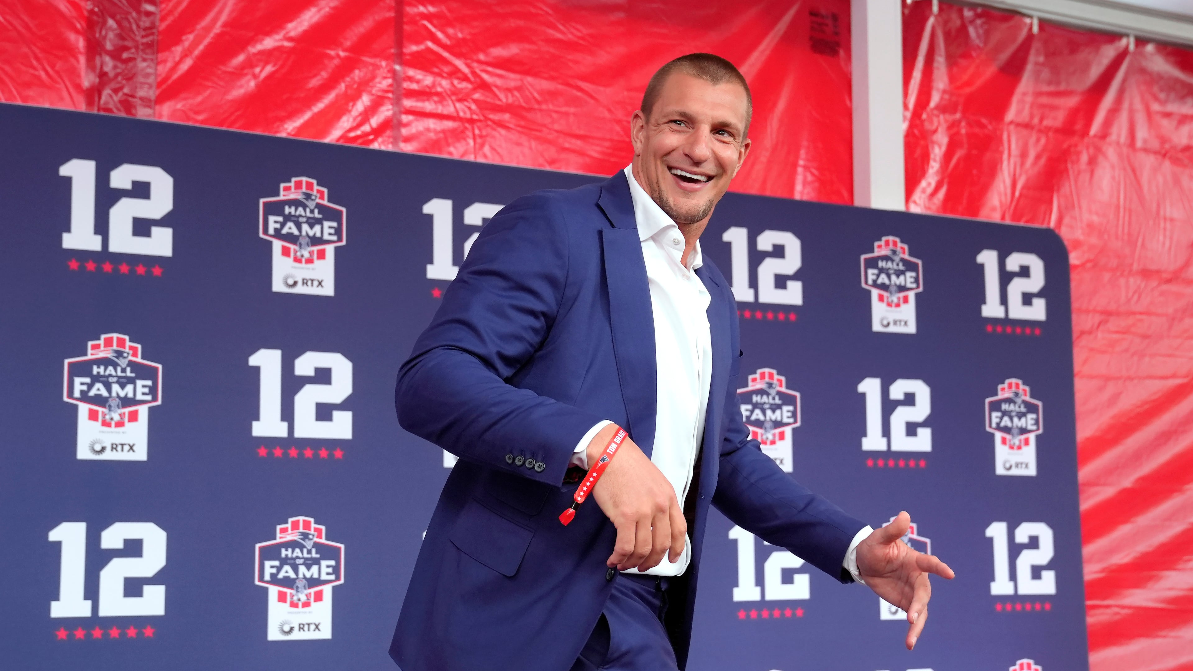 FILE - Former New England Patriots tight end Rob Gronkowski arrives for the Patriots Hall of Fame induction ceremony for former Patriots quarterback Tom Brady, at Gillette Stadium on June 12, 2024, in Foxborough, Mass. (AP Photo/Steven Senne, File)
