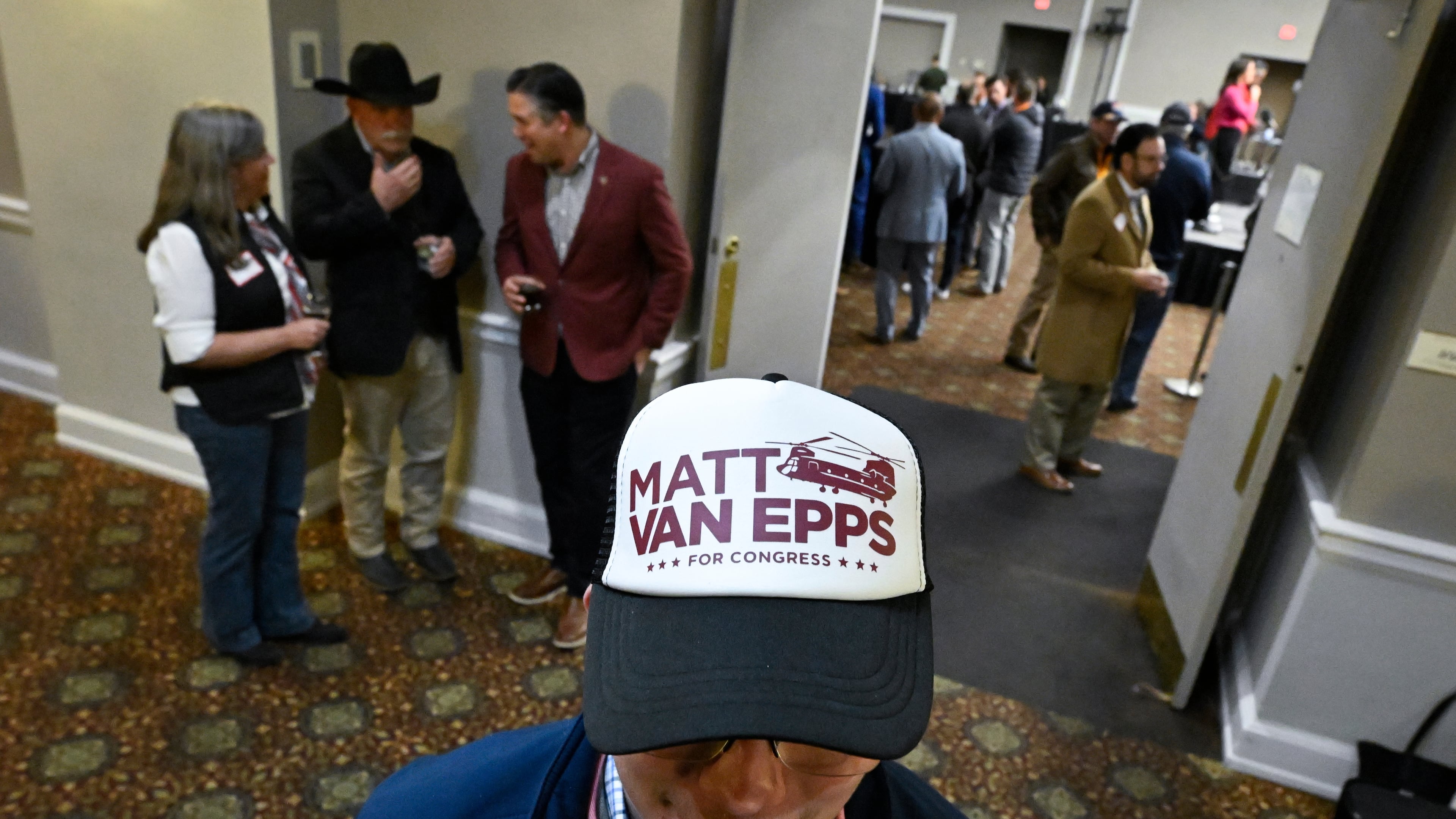 Carson Baddeley and other supporters gather for an election night watch party for Republican candidate Matt Van Epps who is running in a special election for U.S. seventh congressional district seat, Tuesday, Dec. 2, 2025, in Nashville, Tenn. (AP Photo/John Amis)