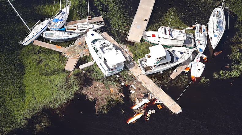September 12, 2017 St. Marys: Boats along with sections of dock are scattered in the marsh, some sitting on the bottom, after Hurricane Irma on Tuesday, September 12, 2017, at St. Marys on the Georgia coast. Curtis Compton/ccompton@ajc.com