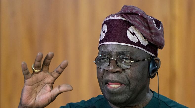 FILE - Nigeria's President Bola Tinubu gives a joint statement with Brazil's President Luiz Inacio Lula da Silva, at the Planalto presidential palace, in Brasilia, Brazil, Aug. 25, 2025. (AP Photo/Eraldo Peres, File)