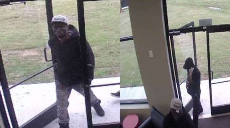 Two men sprayed two Gwinnett County cellphone store employees with mace, bound them with duct tape, and robbed the store of 65 smartphones, tablets and other mobile devices, police said. (Credit: Gwinnett County Police Department)