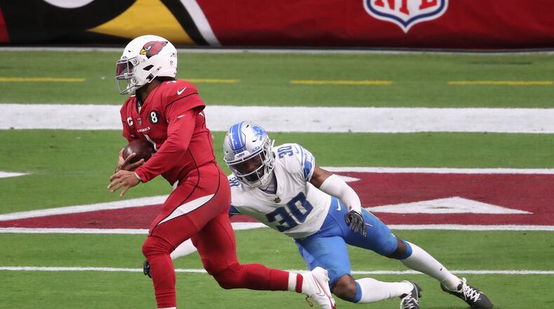 Arizona Cardinals quarterback Kyler Murray evades Detroit Lions cornerback Jeff Okudah (30) to scramble for a touchdown at State Farm Stadium in Glendale, Arizona, on Sept. 27, 2020. He'll be the focus of the Los Angeles Rams in a showdown game on Monday Night Football, Dec. 13, 2021. (Christian Petersen/Getty Images/TNS)