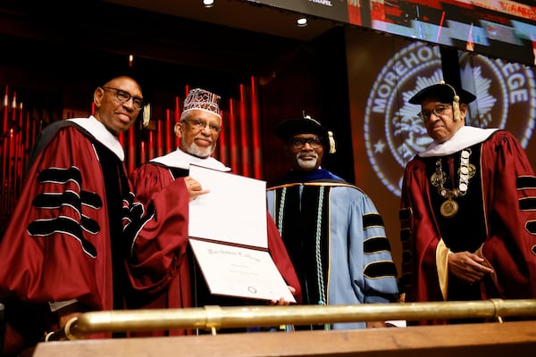 Iman Phelmon El-Amin (second from the left) receives an honorary degree from Morehouse College for his late uncle, Dennis T. Hubert,  during the 141st Commencement Ceremony of Morehouse College on Sunday.