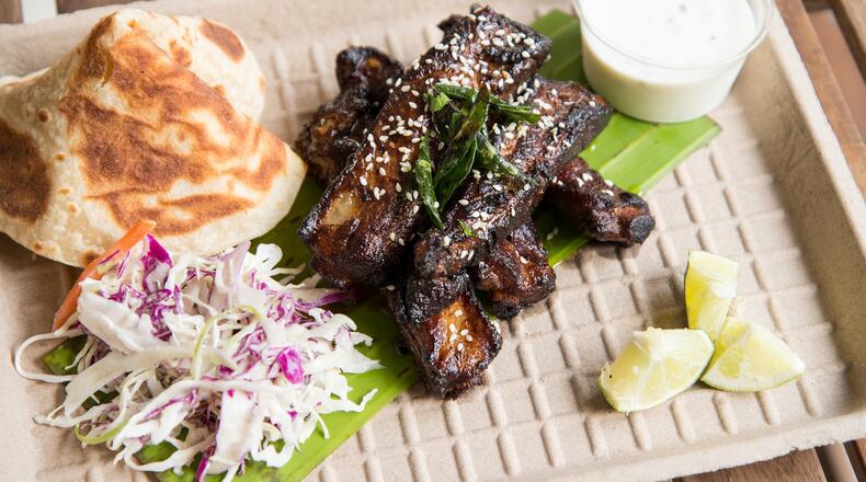 So intense is the fruit-spiked flavor in these ribs, you can’t imagine eating more than a couple — until you devour several more. PHOTO CREDIT: Mia Yakel