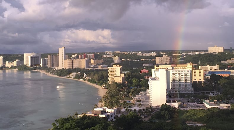 A rainbow appears over Tumon Bay, Guam Sunday, Aug. 13, 2017. Residents of the U.S. Pacific island territory of Guam face a missile threat from North Korea. (AP Photo/Tassanee Vejpongsa)