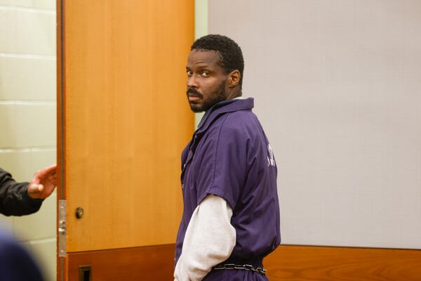 Ciarre Campbell leaves a Fulton County courtroom following a brief hearing on Tuesday, July 21, 2026. His attorney, Jay Abt, withdrew a request for bond before the court proceedings began. (Arvin Temkar/AJC)