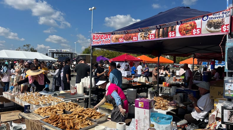 A vendor sells Korean street food like fried dumplings, Korean sweet pancakes called hotteok and Korean spicy rice cakes called tteokbokki at the 2024 Korean Festival on October 6, 2024.