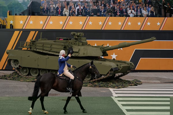 President Donald Trump attends a military parade commemorating the Army's 250th anniversary, coinciding with his 79th birthday, Saturday, June 14, 2025, in Washington. (AP Photo/Julia Demaree Nikhinson)
