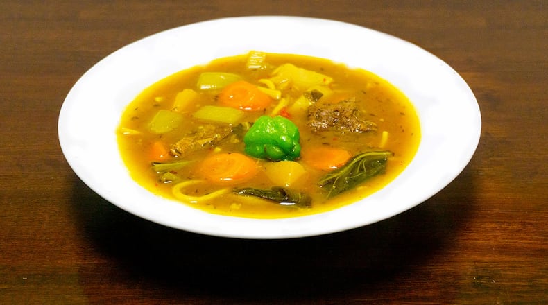 Soup joumou is served every Sunday at Jojo Fritay in Kennesaw; made with calabaza squash and butternut squash, the dish holds a special place in the hearts Haitians, who eat it on Haiti's Independence Day, Jan. 1. /
Credit: Tercy Ugens Toussaint