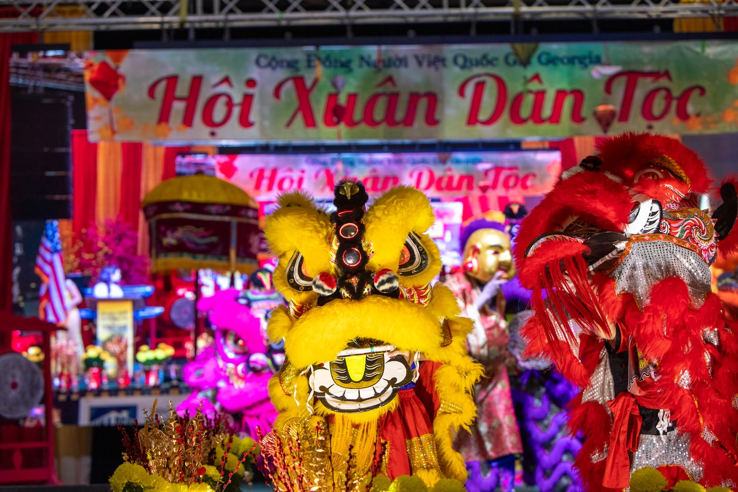 Lion dancers take the stage to open the Lunar New Year celebration, hosted by The Vietnamese American Community of Georgia, at Plaza Las Americas in Lilburn on Saturday, Feb 3, 2024 where dragon and lion dancing begins the weekend.  The celebration continues on Sunday and includes traditional food, music and cultural festivities.  (Jenni Girtman for The Atlanta Journal-Constitution)