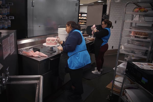 Employees make cakes inside Walmart Supercenter on Wednesday, May 28, 2025, in North Bergen, N.J. (AP Photo/Andres Kudacki)