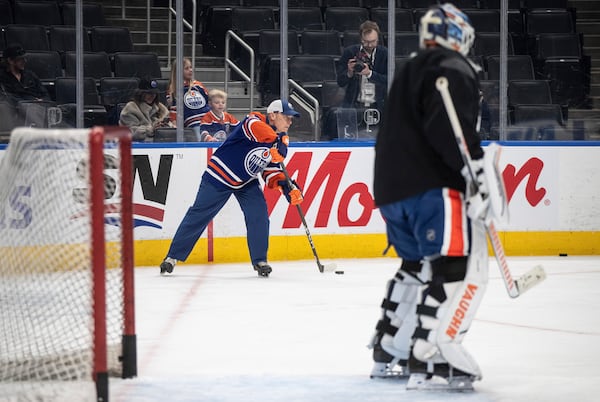 Canadian Prime Minister Mark Carney skates with the Edmonton Oilers NHL hockey team during a visit to Edmonton, Alberta, Thursday, March 20, 2025. (Jason Franson/The Canadian Press via AP)