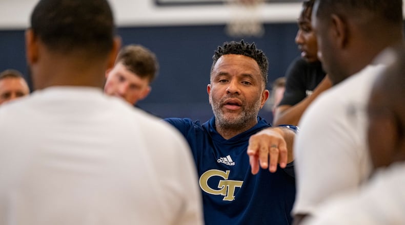 Georgia Tech men's basketball coach Damon Stoudamire works with his team during a practice.
