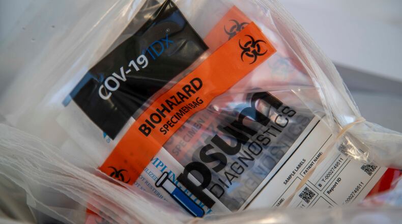 11/17/2020 - Doraville, Georgia - COVID-19 test kits are ready for use during a DeKalb County Department of Health drive-thru COVID-19 testing site in Doraville, Tuesday, November 17, 2020. (Atlanta Journal-Constitution)