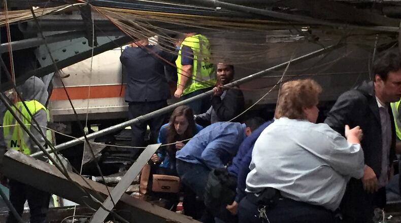 HOBOKEN, NJ - SEPTEMBER 29: Passengers rush to safety after a NJ Transit train crashed in to the platform at the Hoboken Terminal September 29, 2016 in Hoboken, New Jersey. New Jersey emergency's management system is reporting more than 100 people were injured in the crash. (Photo by Pancho Bernasconi/Getty Images)